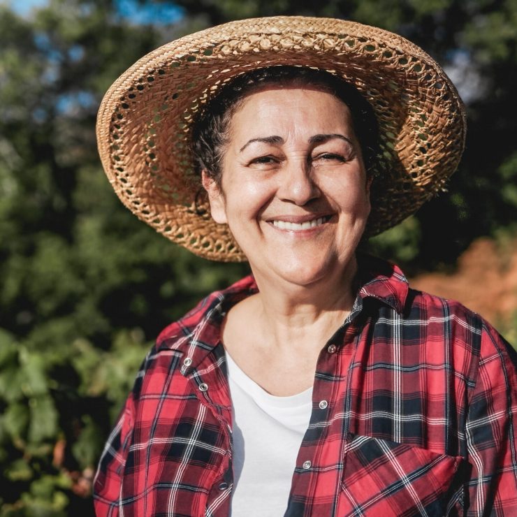 Senior farmer woman work at rural farm smiling at camera – Small business agriculture and harvest concept Happy Latin senior farmer woman work at rural farm smiling at camera - Small business agriculture and harvest concept